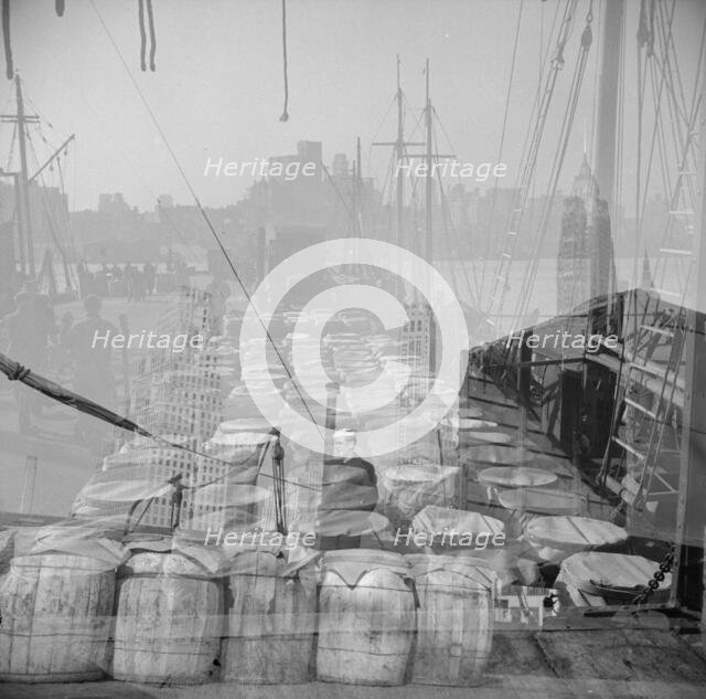 Possibly: Barrels of fish on the docks at the Fulton fish market ready to be..., New York, 1943. Creator: Gordon Parks.