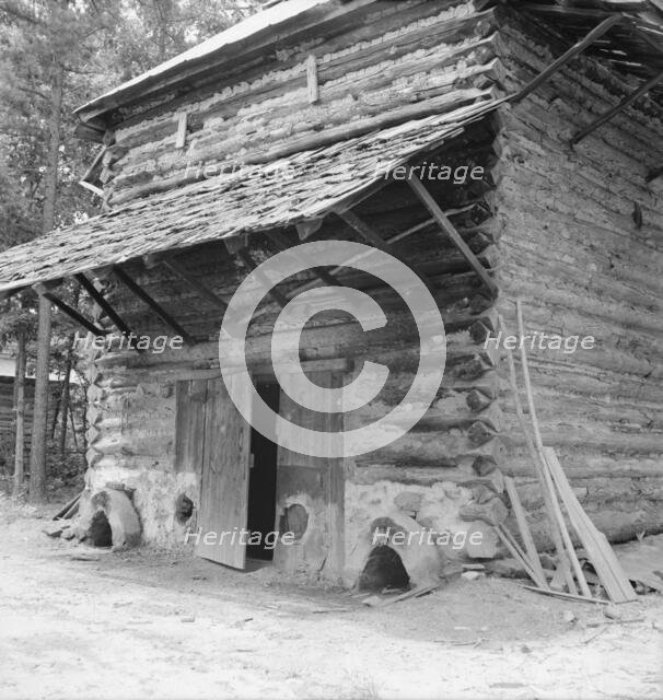 Tobacco barn with newly plastered furnace..., Person County, North Carolina, 1939. Creator: Dorothea Lange.