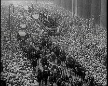 A Large Crowd Watching a Ticker Tape Parade in New York City, 1926. Creator: British Pathe Ltd.