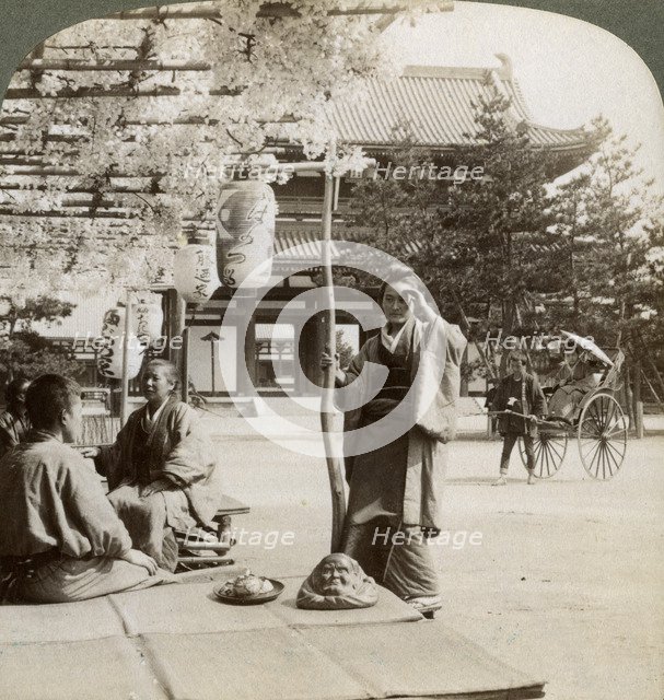 Drooping clusters of wisteria over a tea house porch, Kyoto, Japan, 1904. Artist: Underwood & Underwood