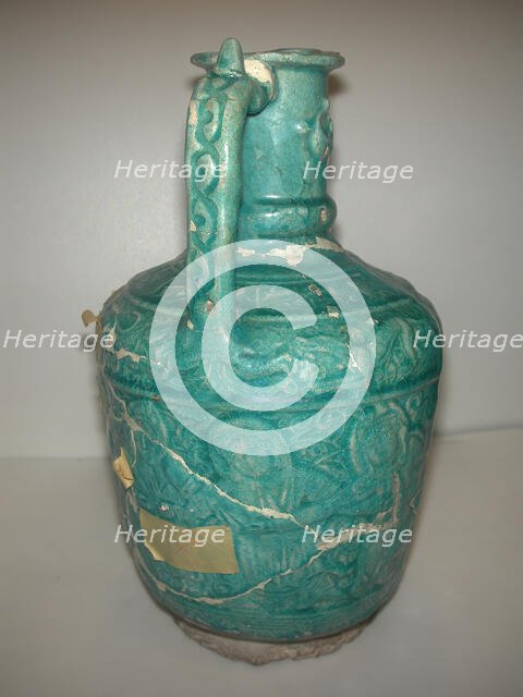 Ewer with Molded Inscriptions, Animals and Dancers, Iran, last quarter 11th or 12th century. Creator: Abu Ahmad Qassai.