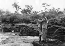 American actors Clark Gable and Grace Kelly filming at the Fourteen Waterfalls, Kenya, 1952. Artist: Unknown