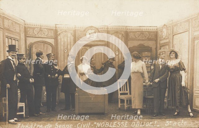 Prisoners of war, some in drag, posing on stage during a crowded scene of "Noblesse...(1910-1919?). Creator: Unknown.