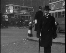 Neville Chamberlain, British Politician, Walking Across a London Street, 1937. Creator: British Pathe Ltd.