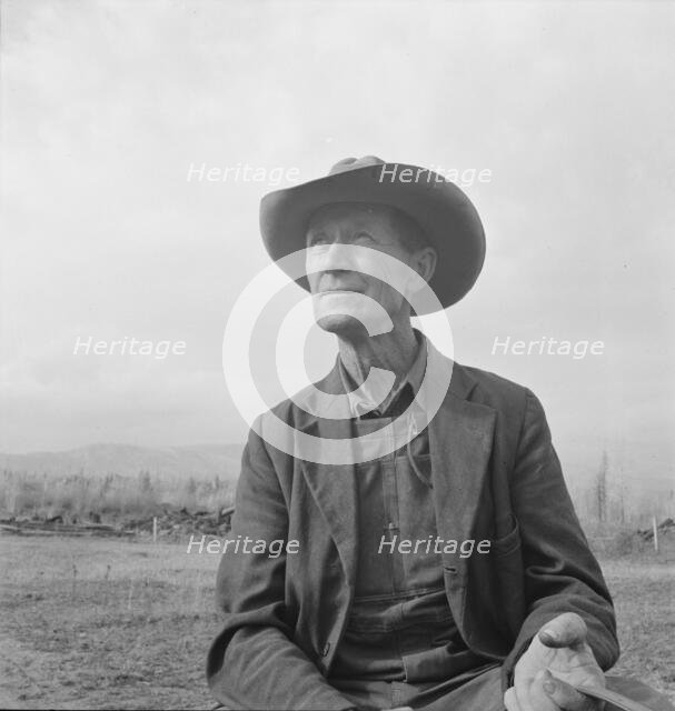 Farmer from Nebraska now developing eighty-acre stump farm, Bonner County, Idaho, 1939. Creator: Dorothea Lange.