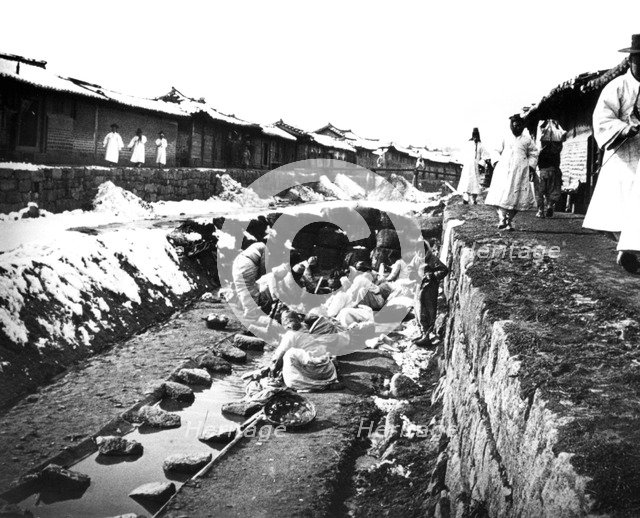 Washing clothes outdoors, Korea, 1900. Artist: Unknown
