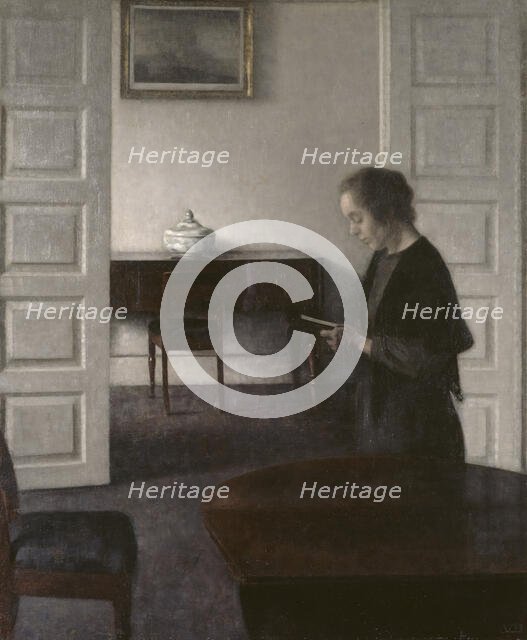 Interior with a Reading Lady, 1900. Creator: Vilhelm Hammershoi.