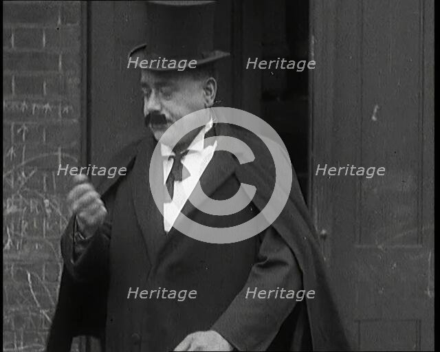 Theatre Star Billy Bennett Walking Out of a Doorway..., 1920s Creator: British Pathe Ltd.