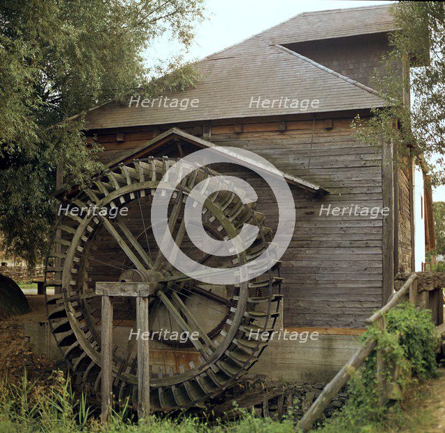Waterwheel for a mill in Hungary. Artist: CM Dixon Artist: Unknown