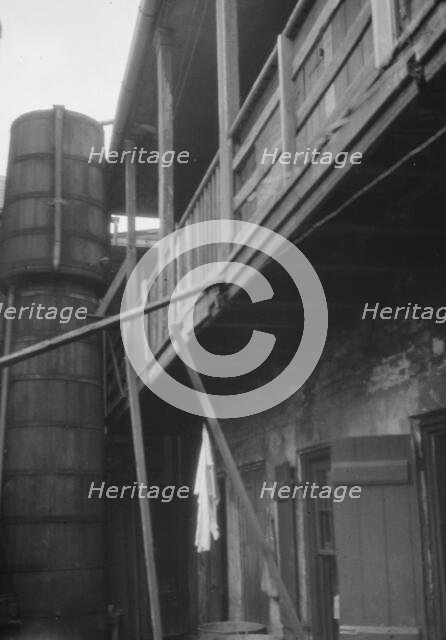 Courtyard with cistern, New Orleans, between 1920 and 1926. Creator: Arnold Genthe.