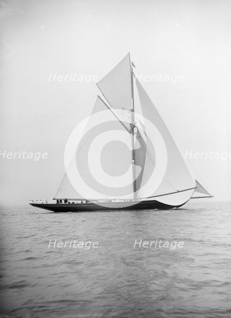 The 221 ton gaff-rigged cutter 'Britannia' sailing under spinnaker 1913. Creator: Kirk & Sons of Cowes.