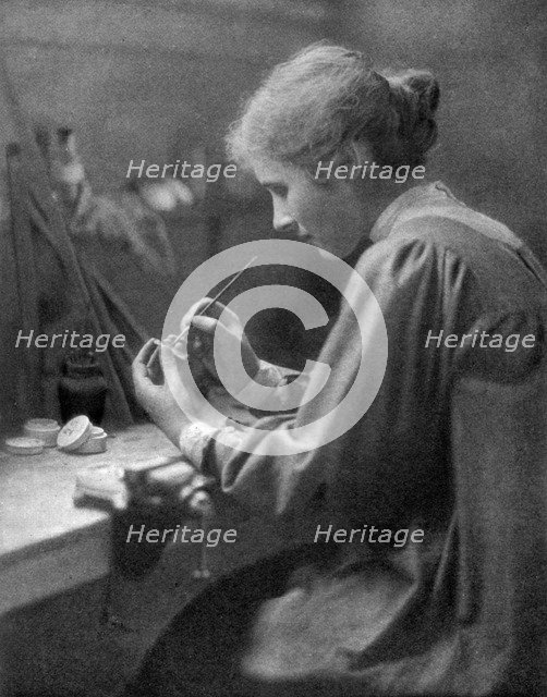 A craftswoman at work, 1911-1912.Artist: ET Holding