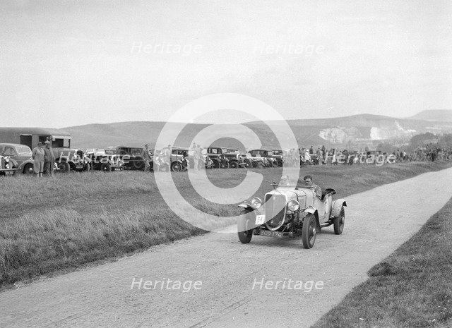 Ford V8 open tourer of GJC Matthews competing at the Lewes Speed Trials, Sussex, 1938. Artist: Bill Brunell.