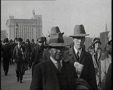 Pedestrians And Commuters Crossing London Bridge, 1920s. Creator: British Pathe Ltd.