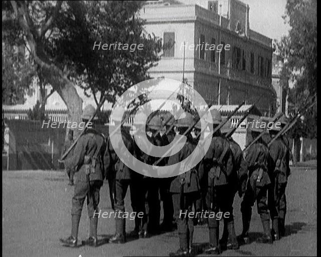 Soldiers Carrying Rifles Patrolling Outside the Egyptian Palace After the Assassination of ..., 1924 Creator: British Pathe Ltd.
