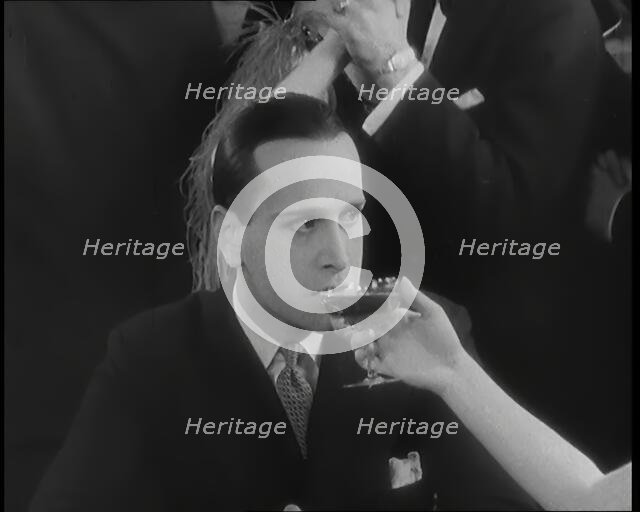 Scene from the Film 'Champagne': Betty Balfour in a Nightclub Drinking Champagne and Giving...,1920s Creator: British Pathe Ltd.