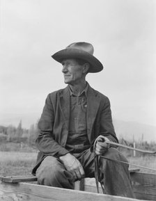 Ex-Nebraska farmer now developing farm out of the stumps, Bonner County, Idaho, 1939. Creator: Dorothea Lange.