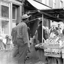 Afro-Caribbean man in a market, London, c1960-c1980. Artist: Henry Grant