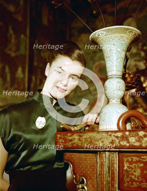 Model wearing an evening dress in oriental style, 1950s.  Artist: Göran Algård