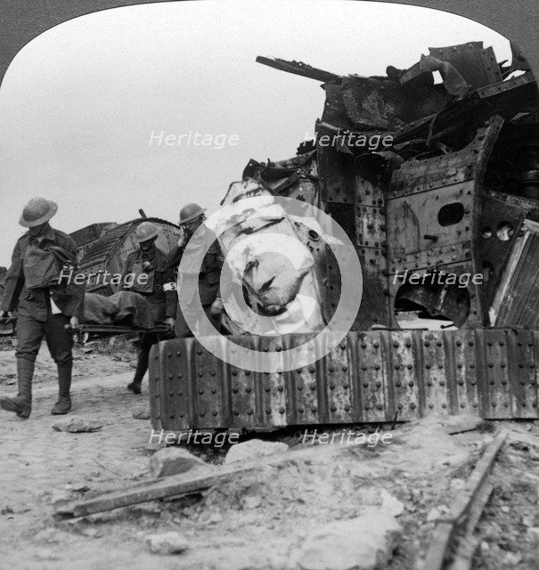 Casualties from the front pass destroyed tanks, Villers-Bretonneux, France, World War I, 1918.Artist: Realistic Travels Publishers