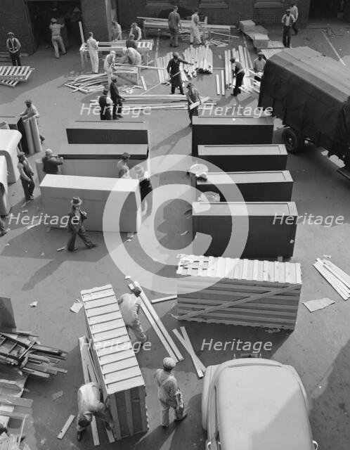 Possibly: United States government workers and carpenters making crates..., Washington, D.C., 1942. Creator: Gordon Parks.