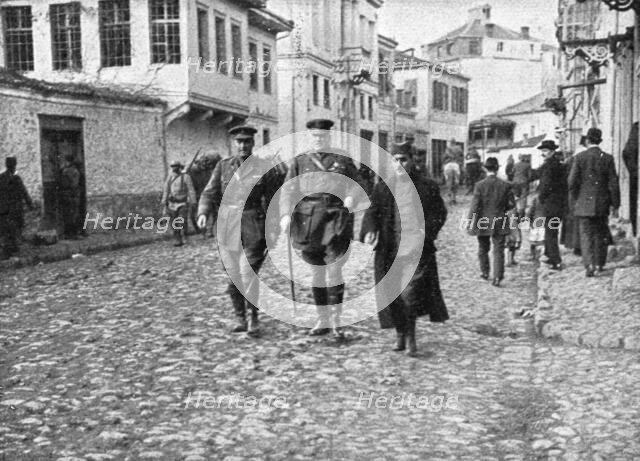 'La derniere etape de l'offensive; L'amiral anglais Troubridge visitant la ville reconquise', 1916. Creator: Unknown.