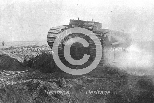 'Un tank en action; la tourelle de gauche est armee d'un petit canon de marine a tir rapide', 1916. Creator: Unknown.