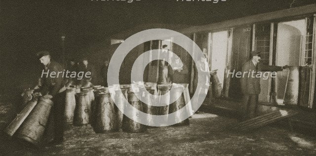 Unloading a milk train, London, 20th century. Artist: Unknown