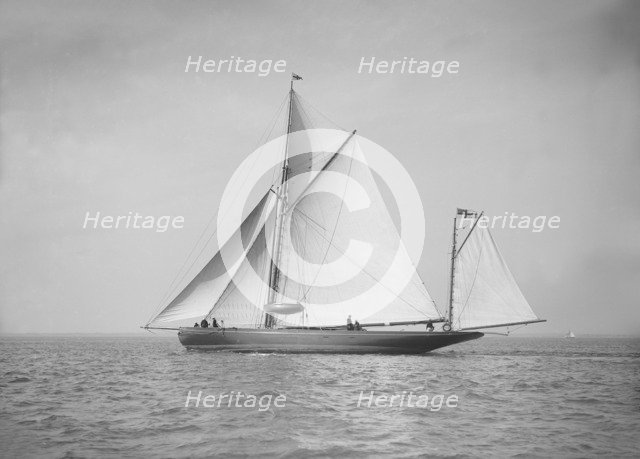 The 95 ft yawl 'Artemis' sailing close-hauled, 1911. Creator: Kirk & Sons of Cowes.