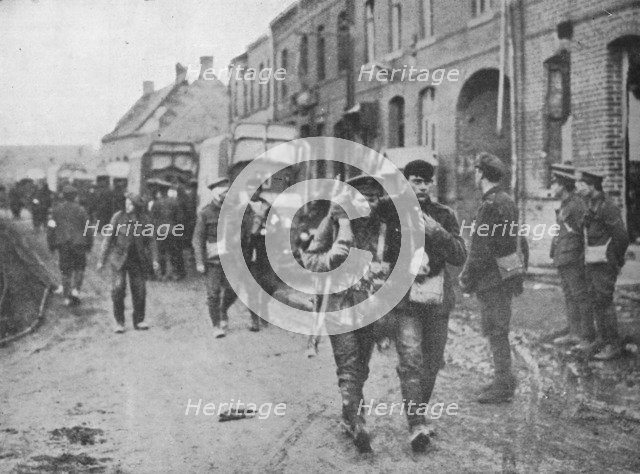 'The British wounded returning to a dressing station after an attack', 1915. Artist: Unknown.