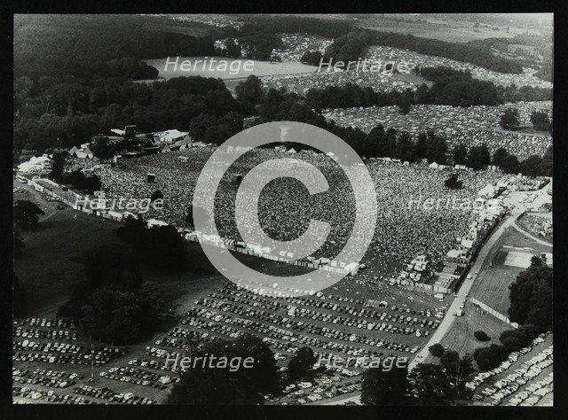 Aerial view of crowds at the Knebworth pop festival, 1986. Artist: Denis Williams