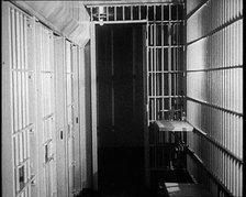 Inside of an American Prison, Corridor and Cells, 1930s. Creator: British Pathe Ltd.