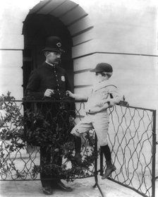 Archie Roosevelt and his friend the policeman, c1902 June 17. Creator: Frances Benjamin Johnston.