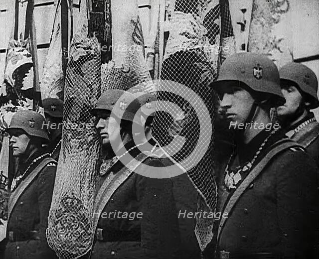 German Soldiers Standing With Flags, 1941. Creator: British Pathe Ltd.