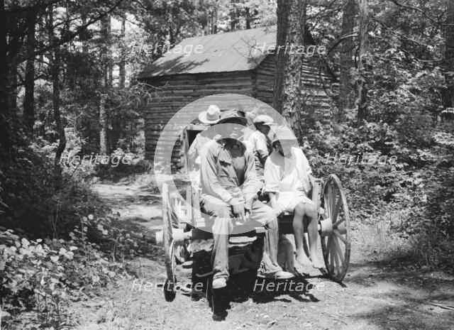 Possibly: Colored sharecropper and his children about to leave..., Shoofly, North Carolina, 1939. Creator: Dorothea Lange.