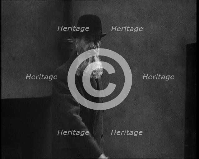 A Man Sporting a Beaver Beard Walking Along a Street, 1922. Creator: British Pathe Ltd.