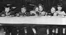 East End children being fed by a charitable organisation, London, 1926-1927. Artist: Unknown