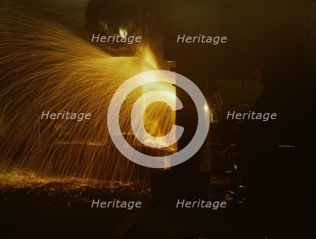 A welder who works in the round-house at the Chicago and Northwestern Railroad's Proviso yard, 1942. Creator: Jack Delano.