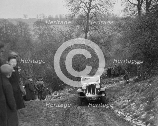 Standard Nine saloon of Mrs M Vaughan competing in the Sunbac Colmore Trial, Gloucestershire, 1933. Artist: Bill Brunell.