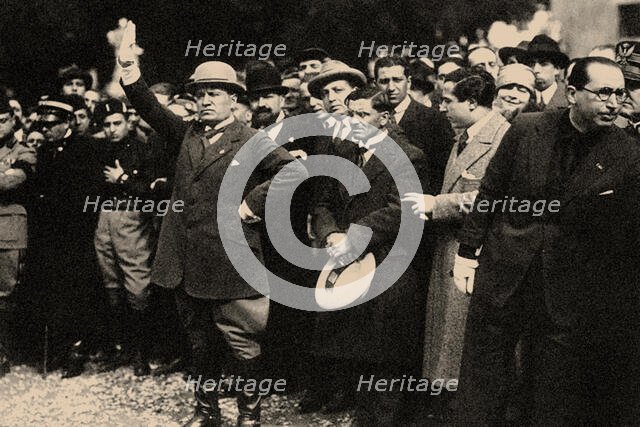 Benito Mussolini, between the members of the Fascist Party, shortly after the "March on Rome". Creator: Anonymous.