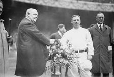 Edward McCall presents a silver basket of flowers to New York Giants manager John McGraw..., 1913. Creator: Bain News Service.