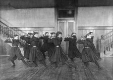Female students exercising with dumbbells, Western High School, Washington, D.C., (1899?). Creator: Frances Benjamin Johnston.