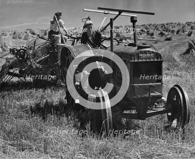 Fordson tractor, with Land girls 1940's. Creator: Unknown.