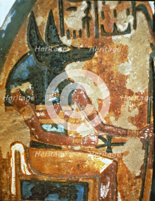 Fragment of a familiar stela in a chapel of worship, showing God Anubis.