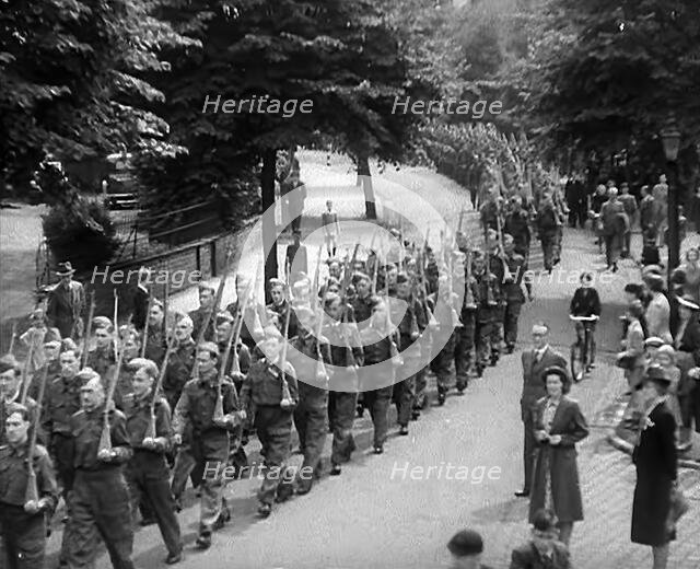 British Local Defence Volunteers Marching in Parade, 1940. Creator: British Pathe Ltd.