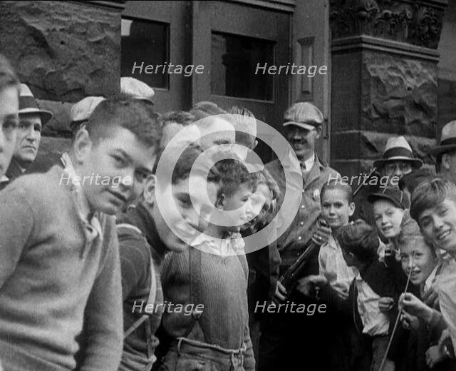 A Group of American Children Civilians Gathering Outside an Official Building with a Male..., 1930. Creator: British Pathe Ltd.