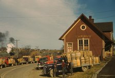 Trucks outside of a starch factory, Caribou, Aroostook County, Maine. , 1940. Creator: Jack Delano.