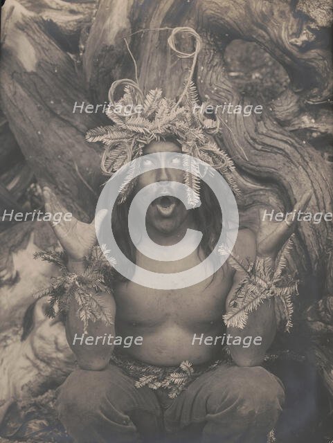 Hamatsa emerging from the woods-Koskimo, c1914. Creator: Edward Sheriff Curtis.