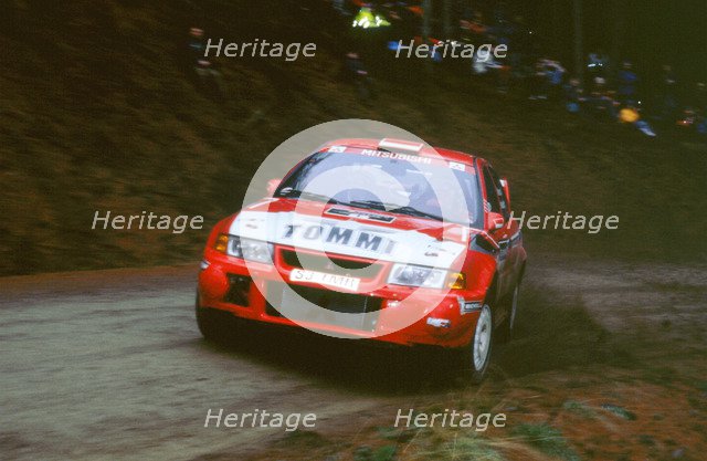 1999 Mitsubishi Lancer EVO, Network Q Rally.Timo Makinen. Artist: Unknown.