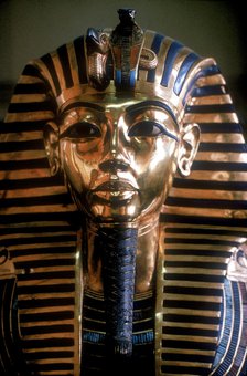 Gold mask of Tutankhamun on his mummy-case. Artist: Unknown